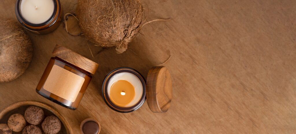 Soy aroma candle in a glass jar with a wooden lid. Candle isolated on white background. Beauty jar