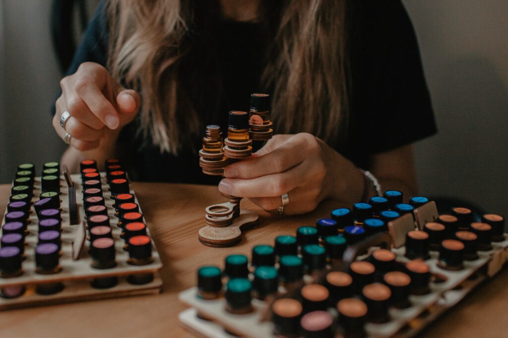 A young woman sniffs essential oil