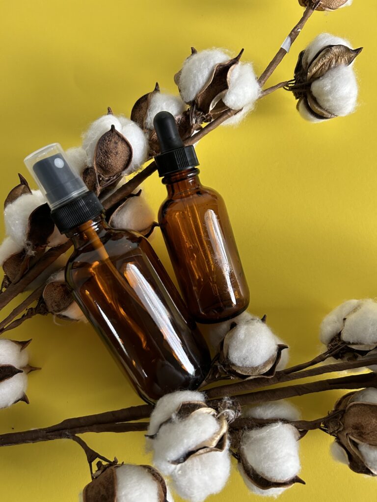 Essential oil bottles with cotton pods