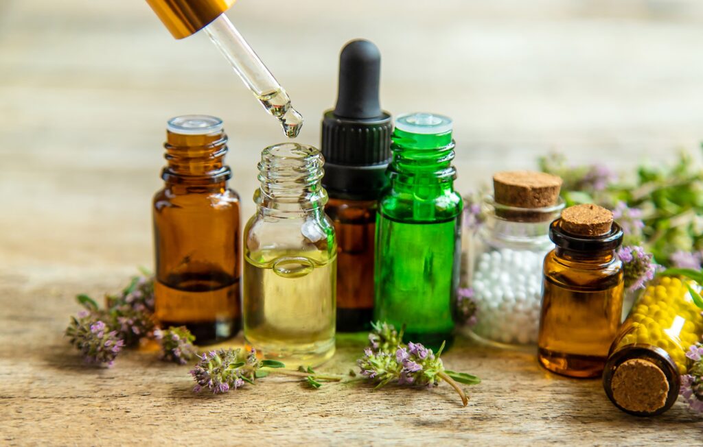 Essential oil of thyme in a bottle. Selective focus.