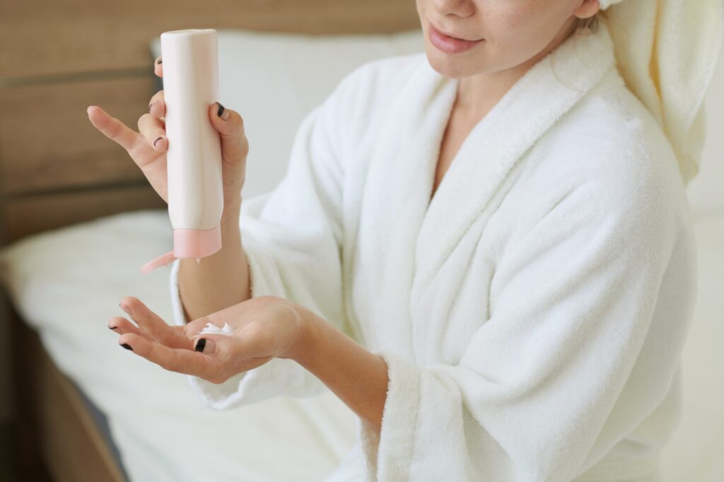 Woman Applying Nourishing Body Lotion