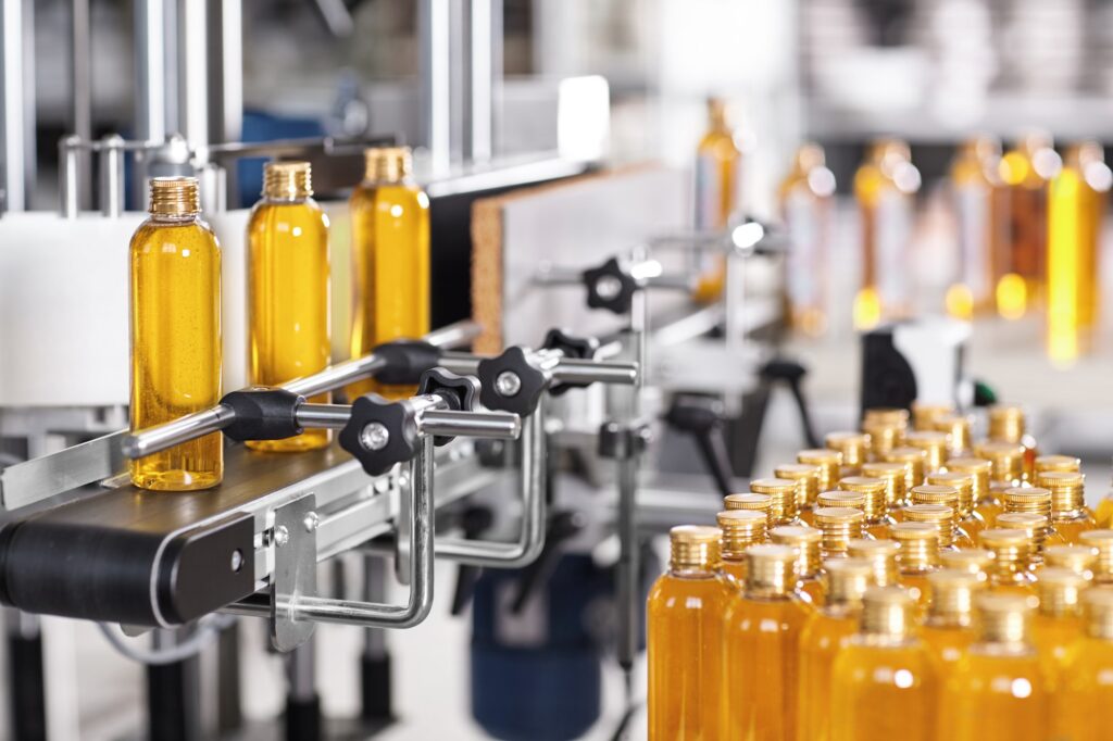 Production line of beauty and healthcare products at plant or factory. Process of manufacturing and