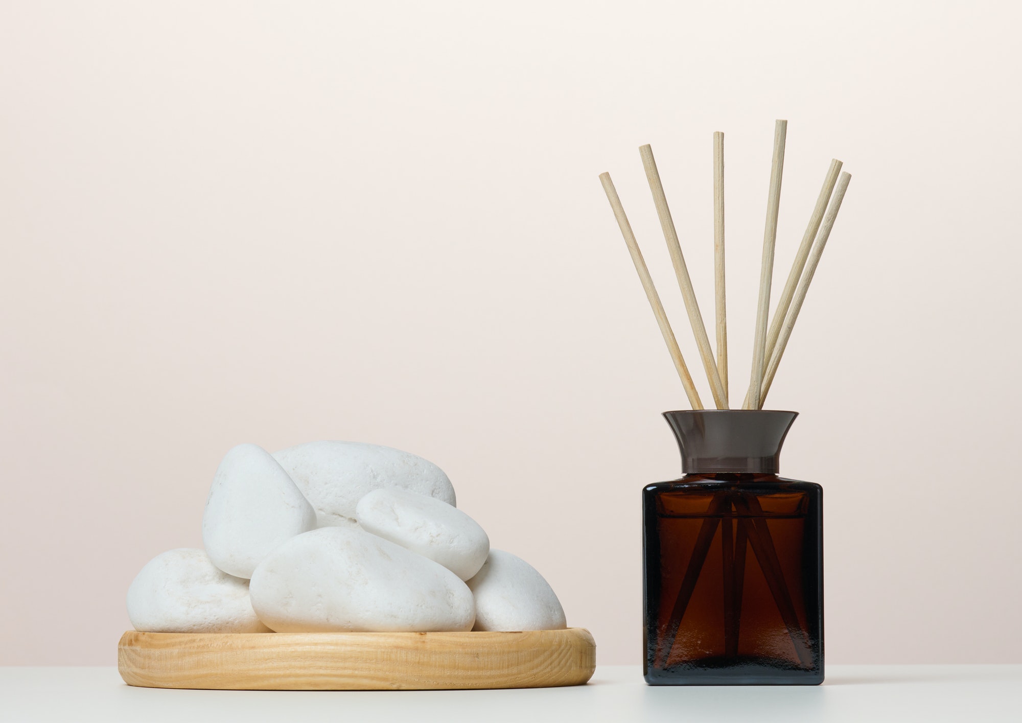 Brown glass bottle and wooden sticks, home fragrance