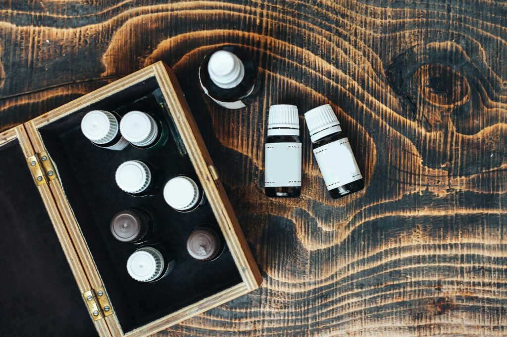 essential oils bottles on wooden background