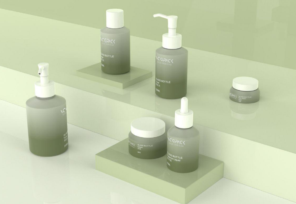 VCPAK’s slant-shoulder cylindrical glass skincare bottles in a green gradient finish